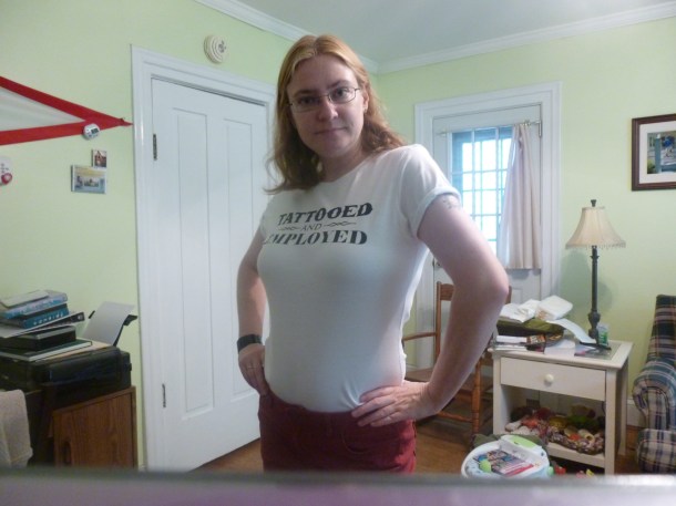A new shirt I am proud of, with my non-jean pants, sucking in my stomach, wearing a leftover goth bracelet on a very humid day where my hair might do something--or not.