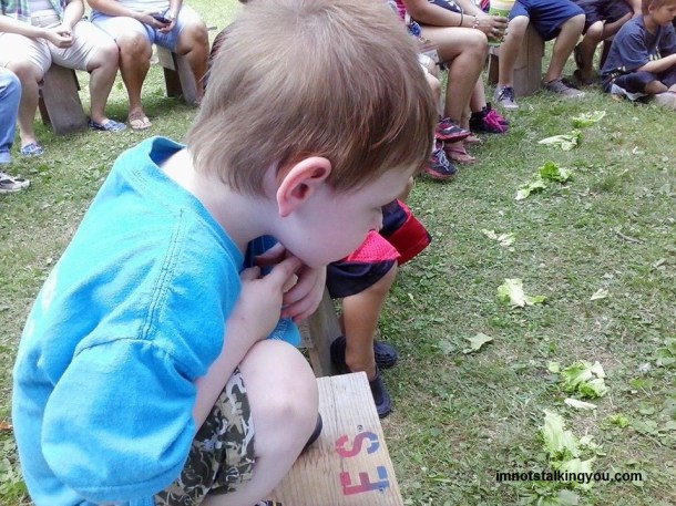 What is M watching so intently?