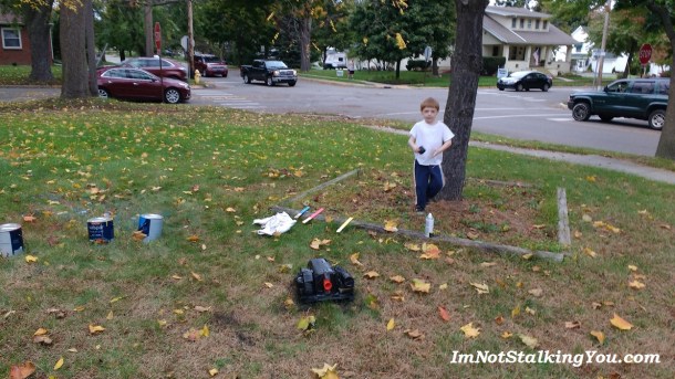 Old clothes and the great outdoor made for good spray painting conditions.