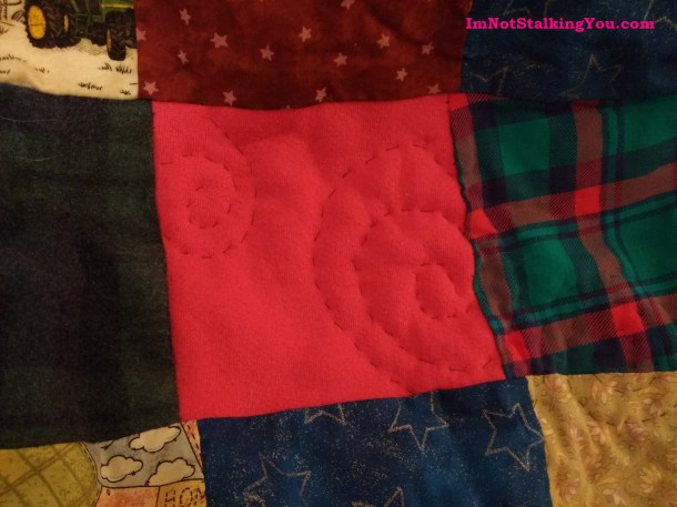 A close-up of the swirly quilting pattern I created myself.